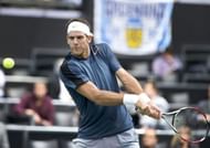Argentina's Juan Martin Del Potro returns the ball to Finland's Jarkko Nieminen in Rotterdam, February 15, 2013